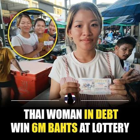 Thai lottery winner holding the ticket that won her the 6 million baht first prize at the market where she works
