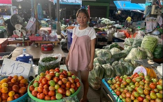 Thai lottery winner Inthira Saisun at her vegetable stall in a Kamphaeng Phet market
